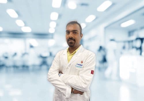 Dr. Kiran B